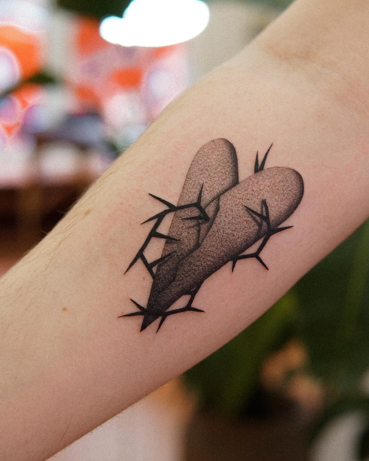 heart tattoo with spikes