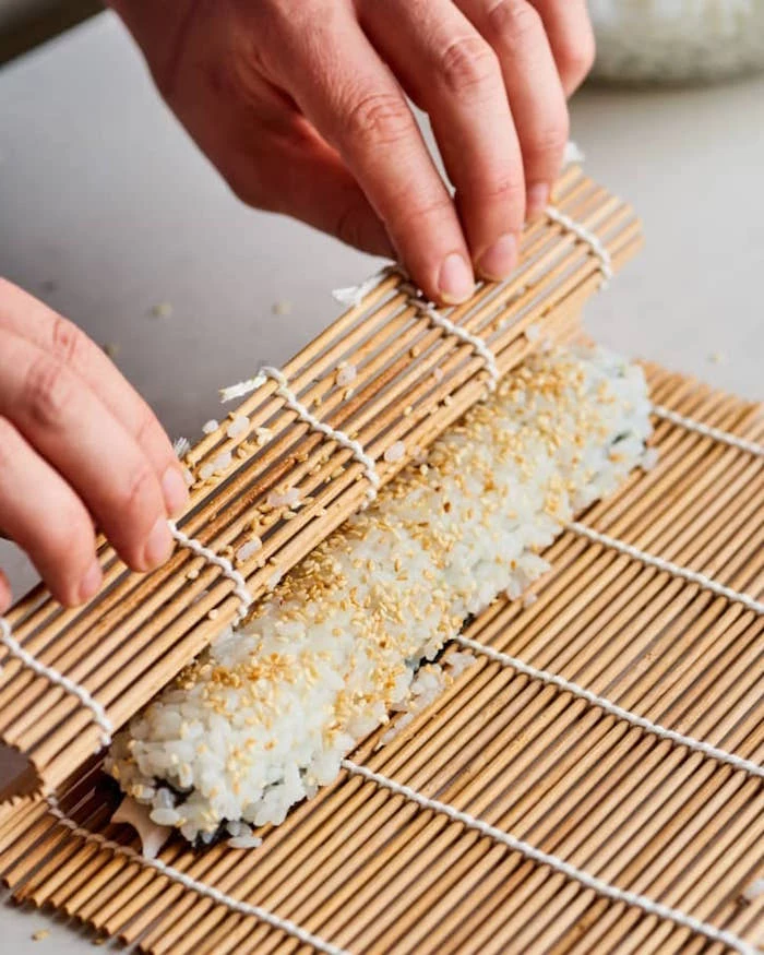 how to california roll with the help of bamboo mat dragon roll sushi with rice sesame seeds