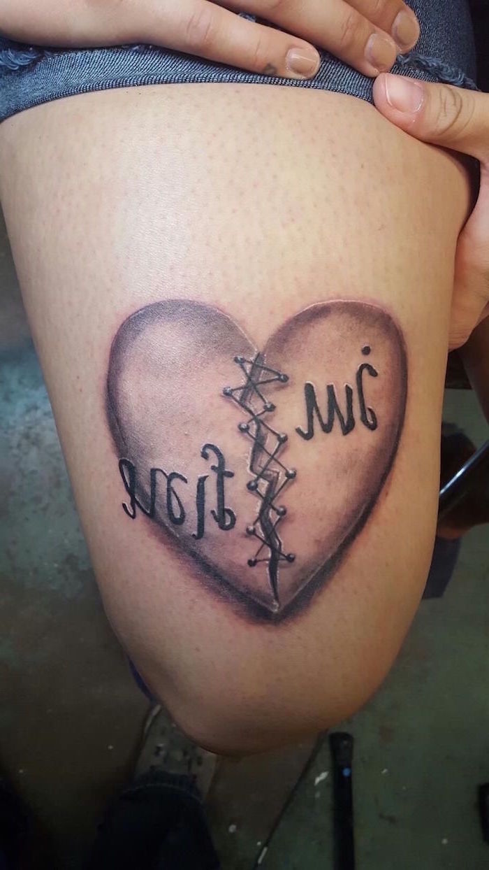 im fine written over leg tattoo of heart split in the middle held together with stitches heart tattoo designs