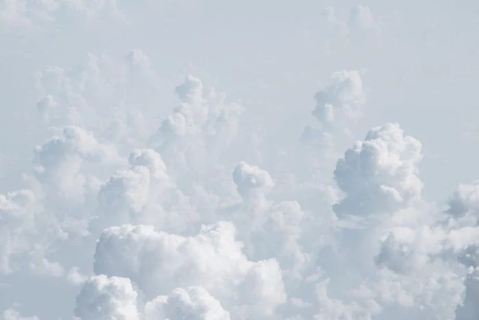 lots of white clouds in the sky minimalist background gray aesthetic foggy sky