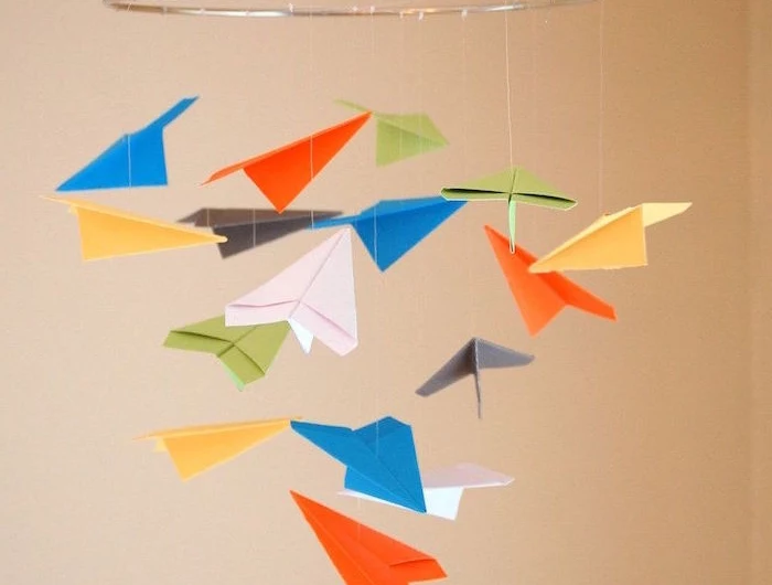 paper airplane decoration hanging from the ceiling how to fold a paper airplane gray metallic ring