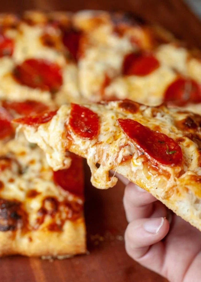 pepperoni pizza with lots of cheese thin crust pizza dough recipe cut into slices