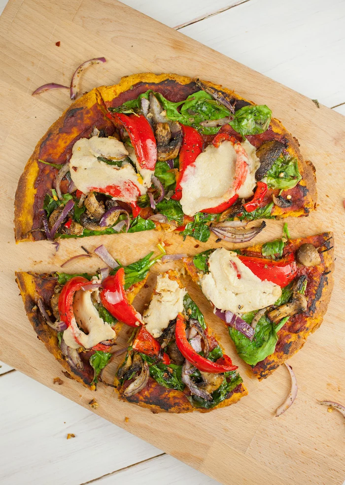 pizza with sweet potato crust homemade pizza dough recipe cut into slices with tomatoes pepper onion