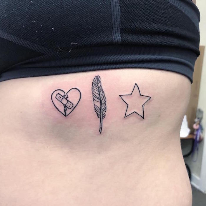 ribcage tattoo heart tattoos with names broken heart with bandage feather and star with black outlines