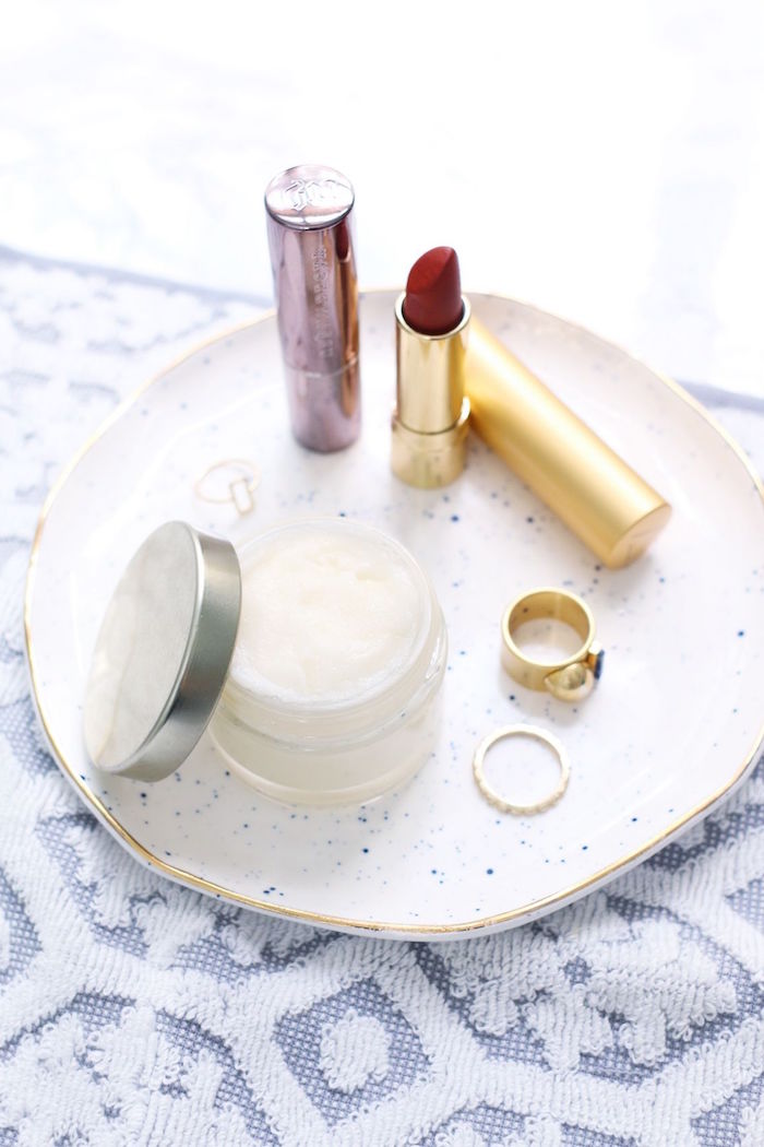 small ceramic plate with red lipstick two gold rings how to use lip scrub plastic container with lip scrub inside