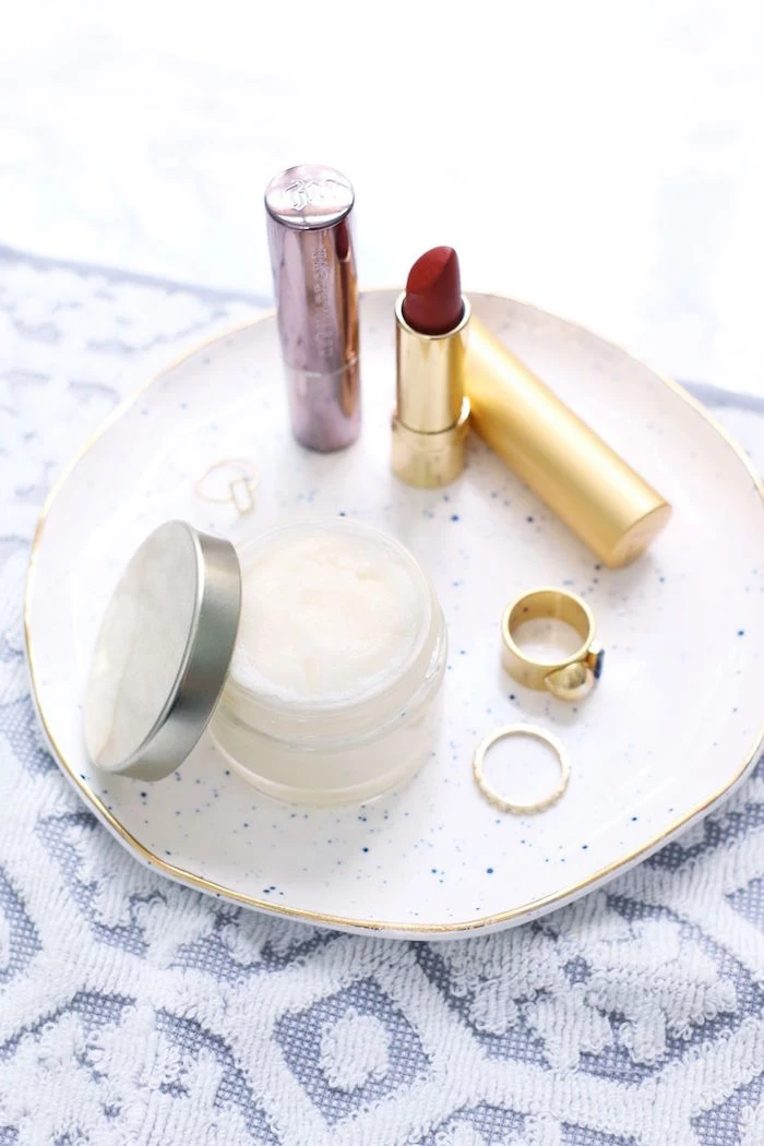small ceramic plate with red lipstick two gold rings how to use lip scrub plastic container with lip scrub inside