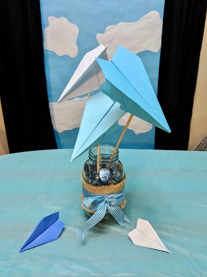table centerpiece how to draw a paper airplane jar filled with chocolate candy three paper airplanes in blue and white