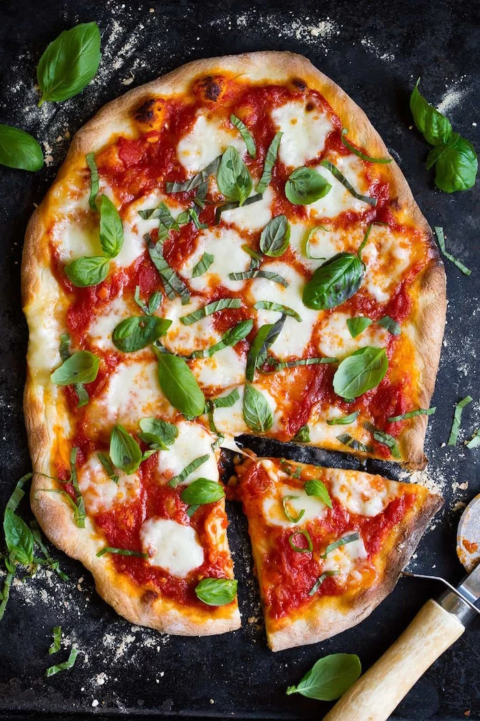 thin crust pizza dough recipe oven baked pizza margherita with tomato sauce mozzarella fresh basil leaves