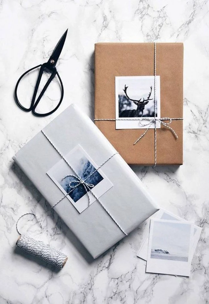 two boxes wrapped with white and brown paper gift packing ideas two photos tied with small ribbons