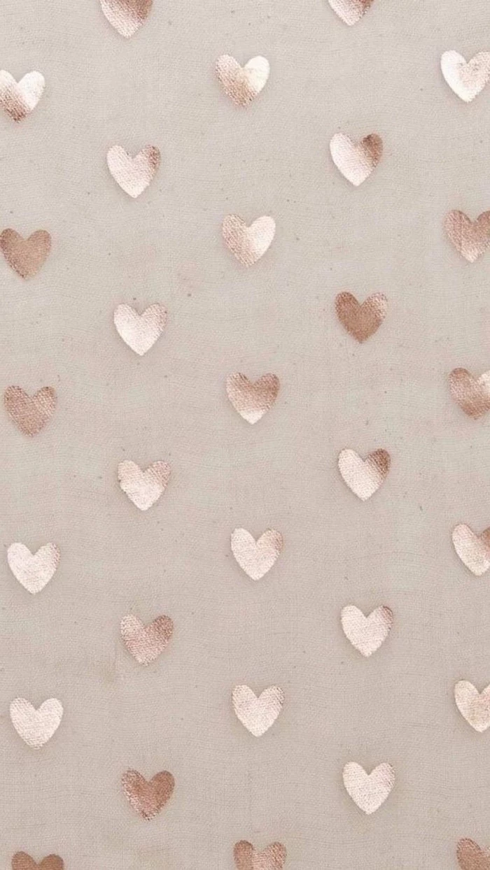 beige background valentine's day 2021 lots of gold hearts spread out around it in the same size
