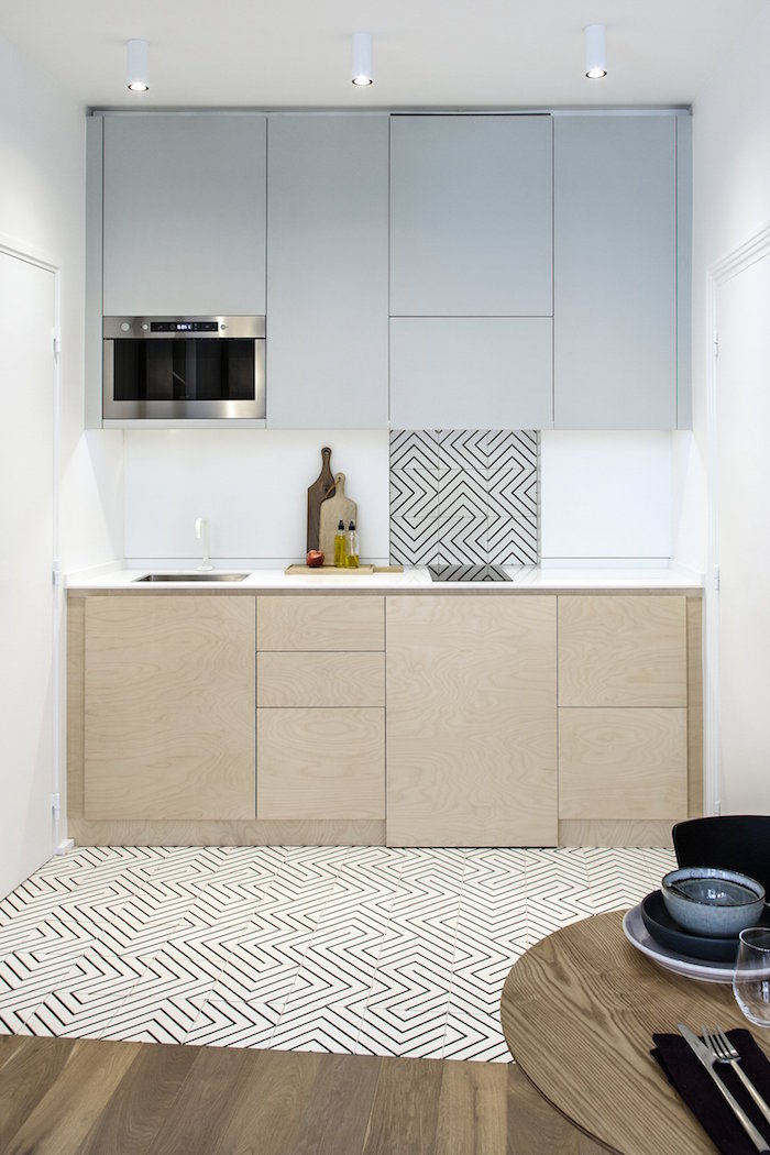 black and white tiles on the floor matching part of the backsplash small kitchen design ideas light gray and wooden cabinets