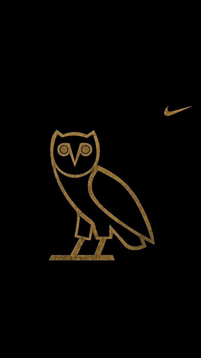 black background with ovo owl logo in gold in the middle black nike wallpaper gold nike logo on the side