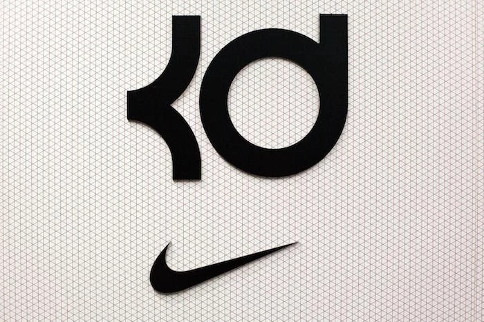 black kd logo over a black nike logo nike background white and black geometric background kevin durant
