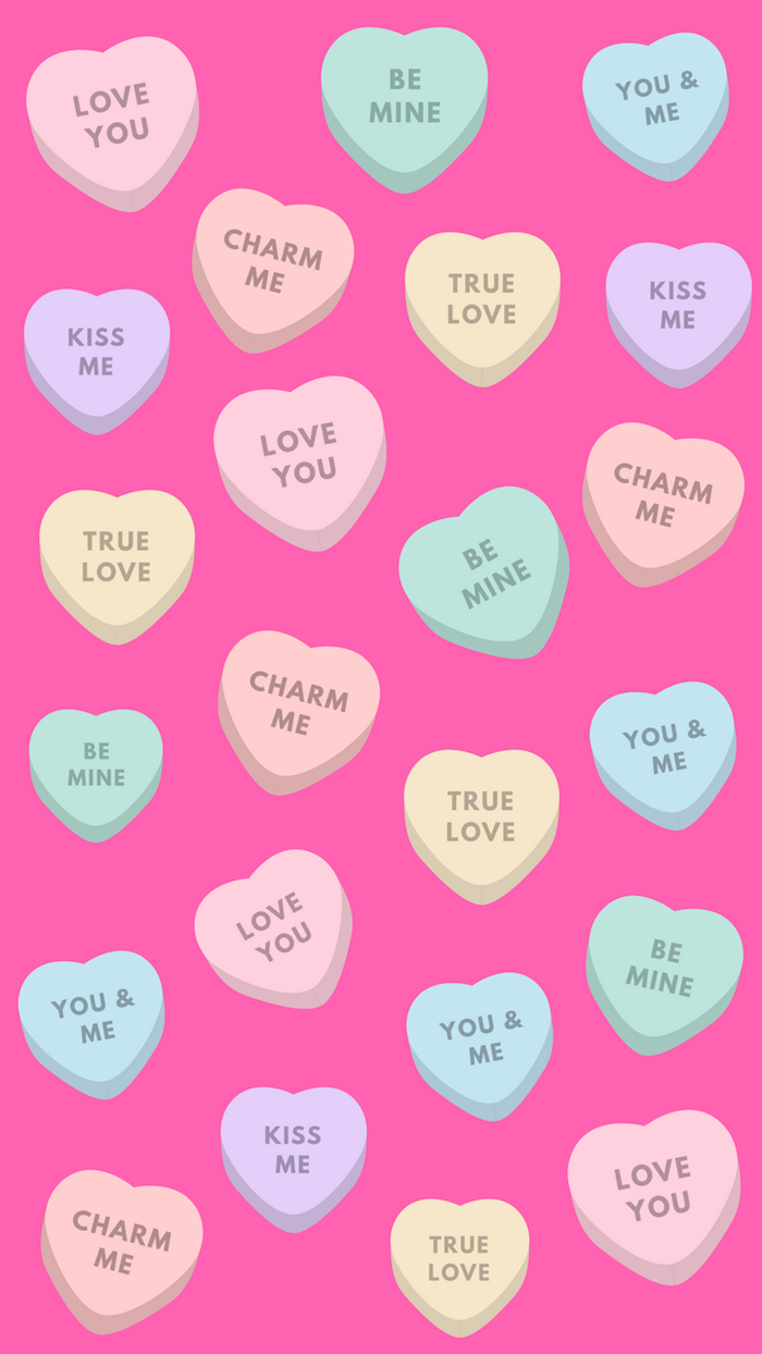 conversation hearts in different sizes and colors why do we celebrate valentine's day dark pink background