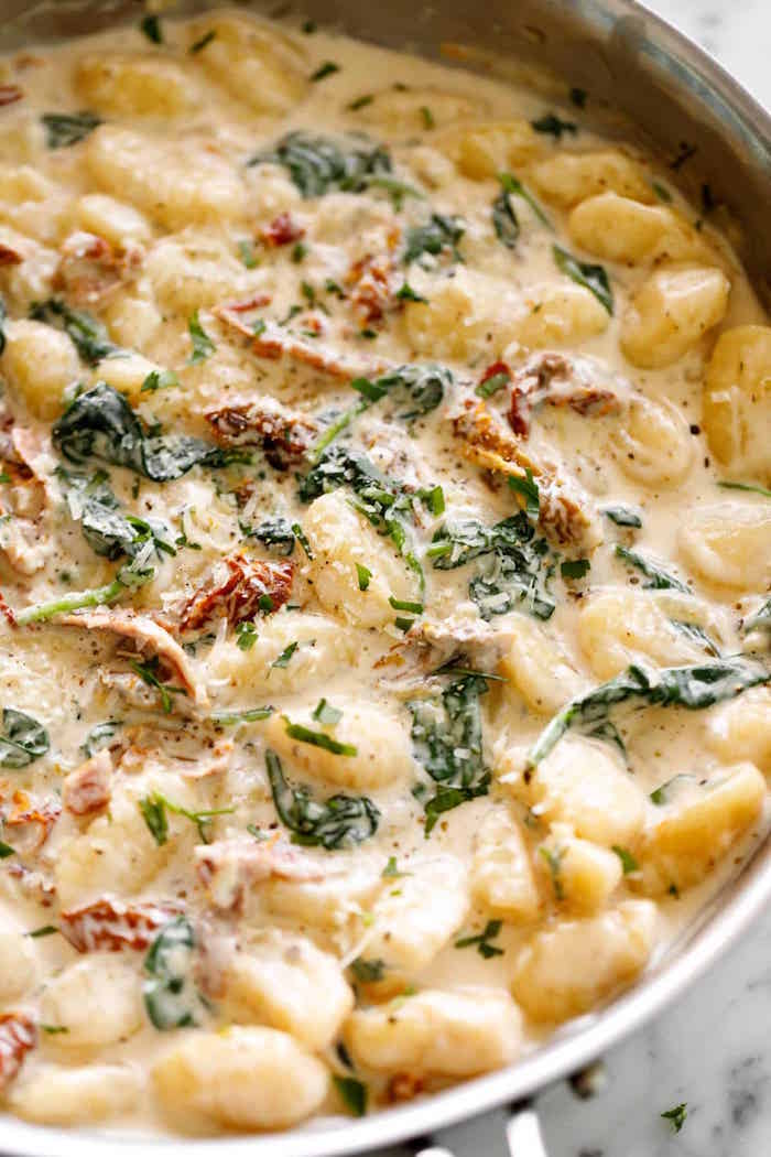 creamy tuscan gnocchi with cheesy sauce sun dried tomatoes recipes using gnocchi basil leaves