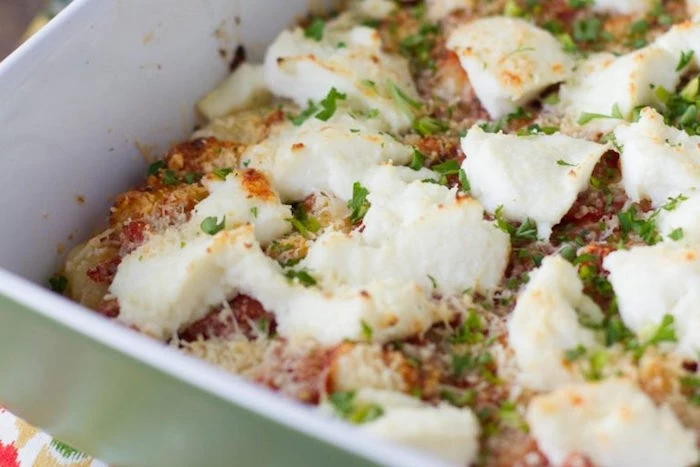 gnocchi baked with ricotta cheese in white casserole dish best gnocchi recipe garnished with chopped parsley