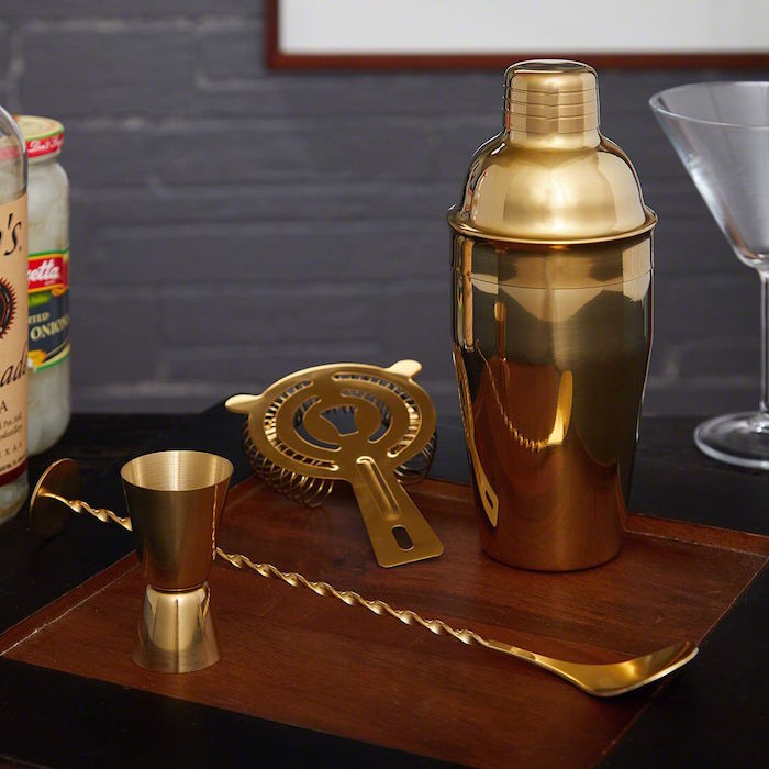 gold bartender kit valentines day gifts for boyfriend shaker spoon measuring cup placed on wooden board