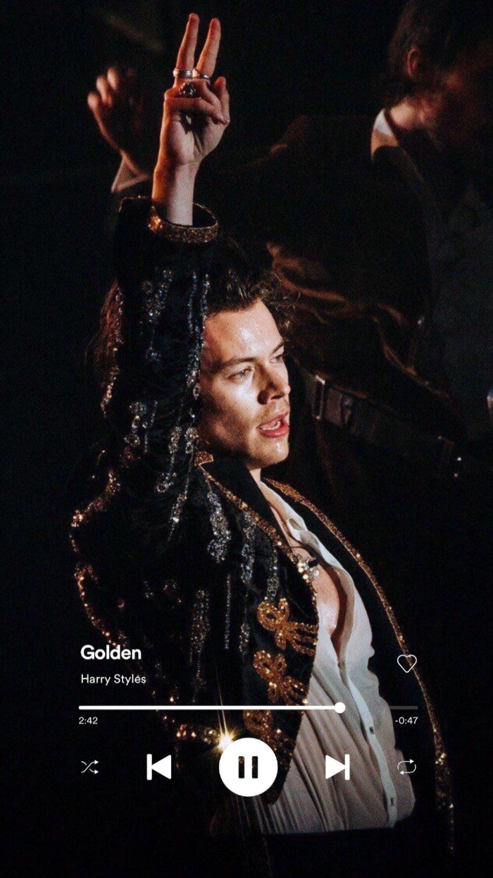 harry styles aesthetic screenshot from spotify playing golden photo of harry on stage wearing sequinned blazer white shirt