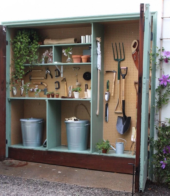 large wooden shed for gardening tools painted in turquoise shelves installed inside diy storage space