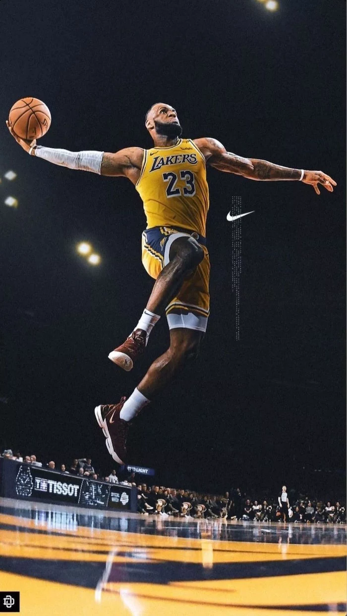 lebron james wearing gold and purple lakers unifrom about to dunk the ball nike logo wallpaper nike logo on the side