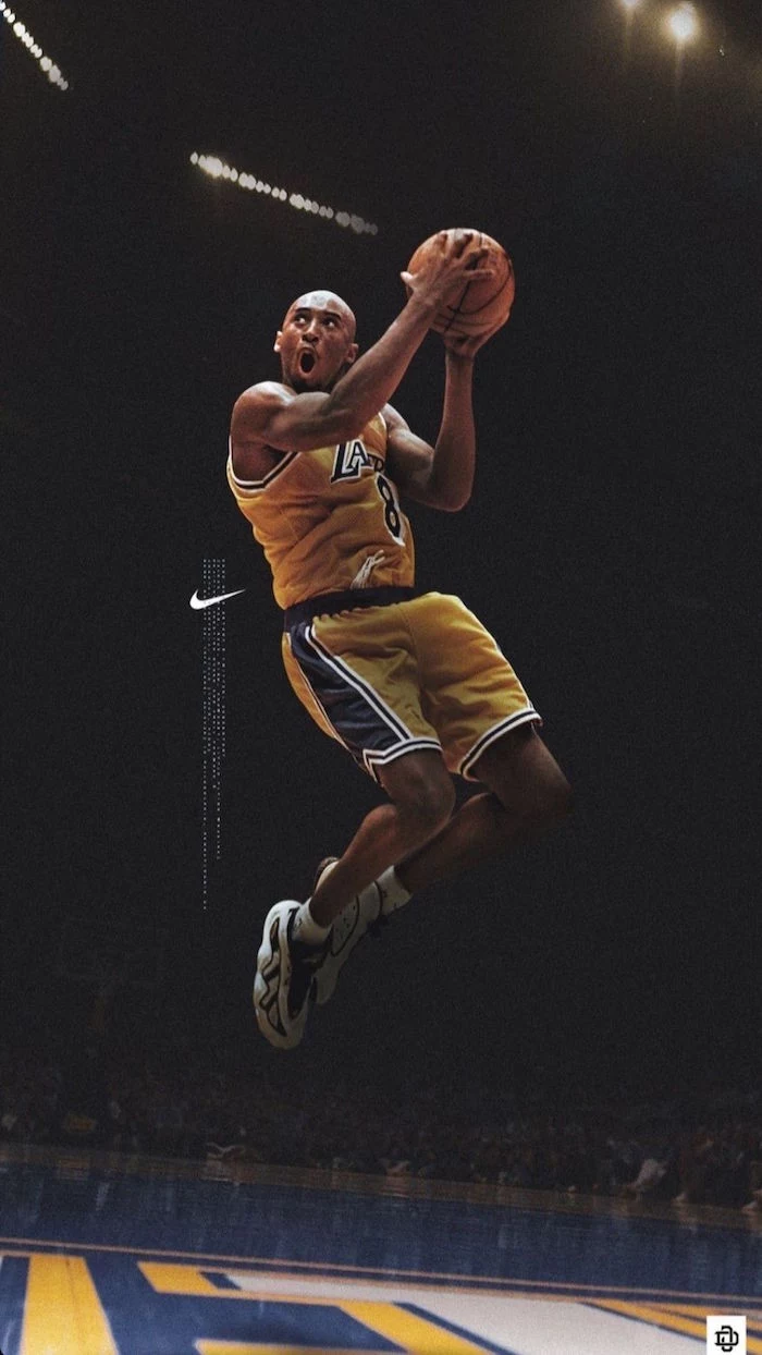 nike shoes wallpaper kobe bryant wearing gold and purple lakers uniform in the air holding the ball nike logo on the side
