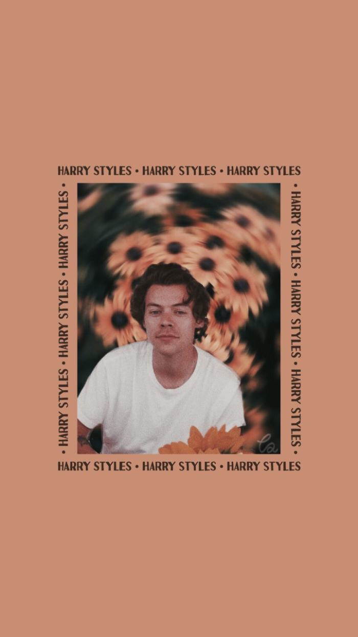 photo of harry in the middle with sunflowers on pink background harry styles aesthetic wallpaper