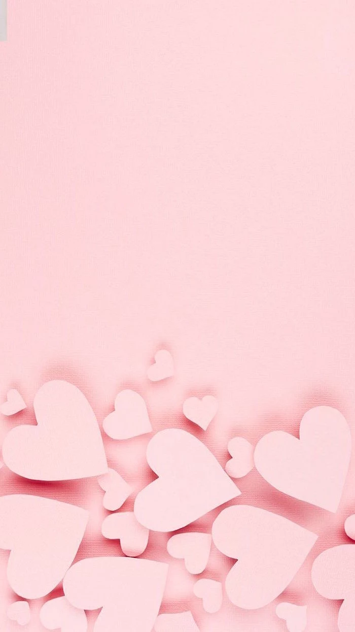 pink background pink hearts in the bottom in different sizes valentine's day 2021 minimalistic wallpaper