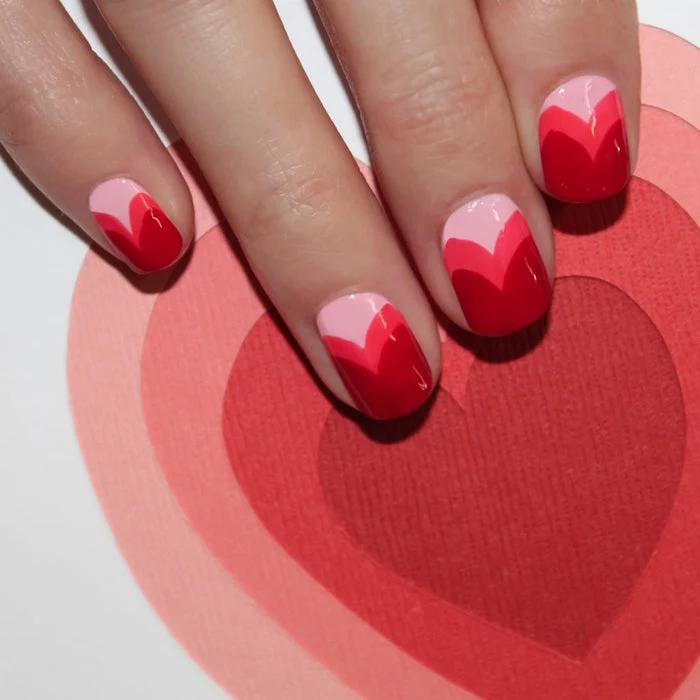 pink red ombre in the shape of hearts on each nail valentines day nail ideas short squoval nails