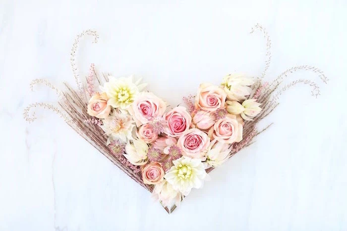 pink yellow roses peony flowers arranged in the shape of hearthappy valentines day pampass grass