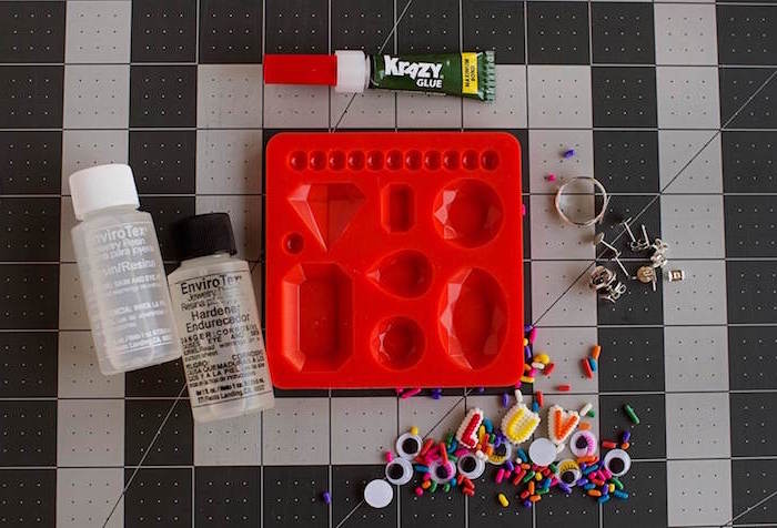 red silicone mold resin silver rings pendants earrings how to make resin jewelry glue layed out for step by step diy tutorial