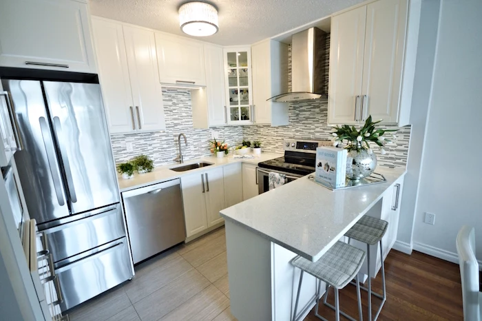 small kitchen design ideas black and white mosaic backsplash white kitchen cabinets and countertop metal bar stools