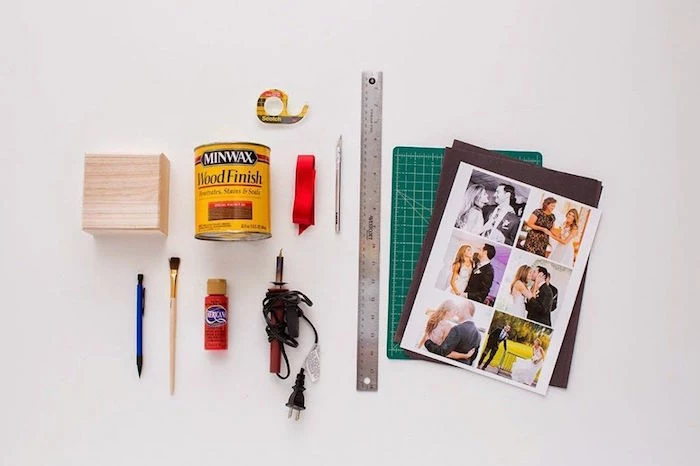 tools for step by step diy tutorial for pop up photo box valentine's day gift ideas for him arranged on white surface