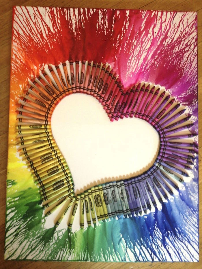 valentine gift for husband melted crayons in the colors of the rainbow in the shape of a heart outlining it