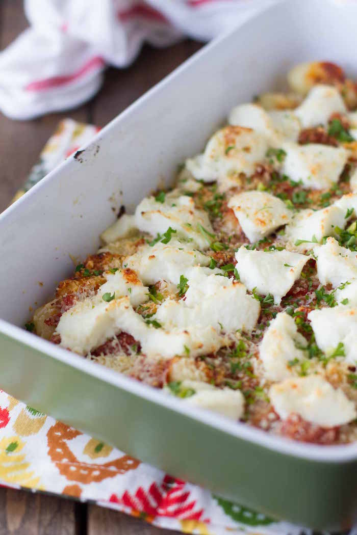 white casserole dish best gnocchi recipe baked gnocchi with ricotta cheese garnished with chopped parsley