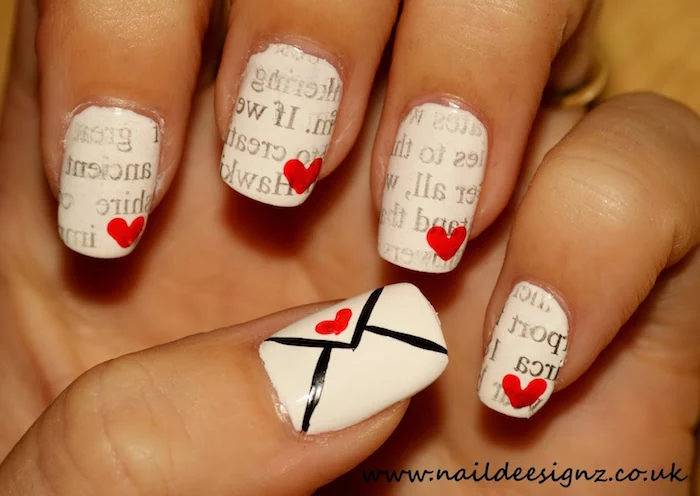 white nail polish with red hearts envelope on the thumb valentines day nails coffin shape letters decorations on each nail