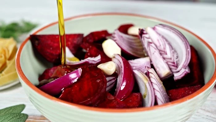 beetroot cut into cubes with onion olive oil drizzled on top in bowl pasta dough recipe