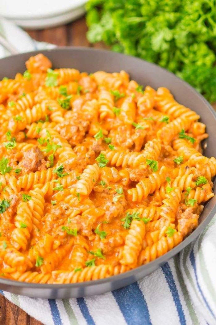 best pasta dishes pasta cooked with ground beef inside saucepan garnished with parsley