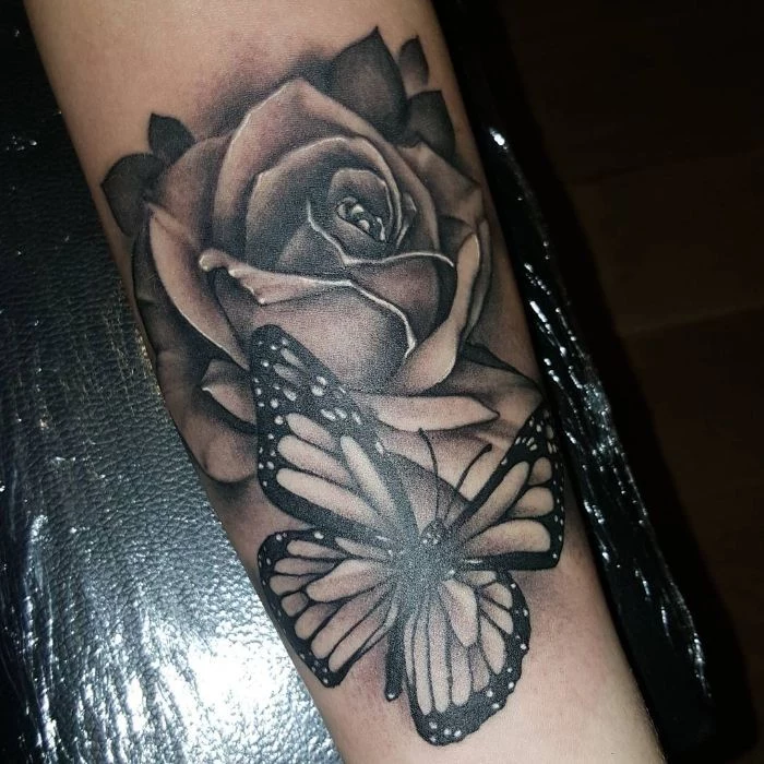 black and white forearm tattoo traditional butterfly tattoo butterfly with a rose