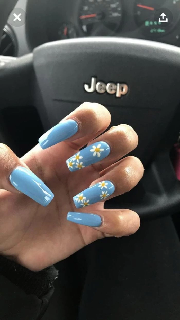 blue nail polish on long coffin nails simple nail designs white daisies decorations on middle and ring fingers