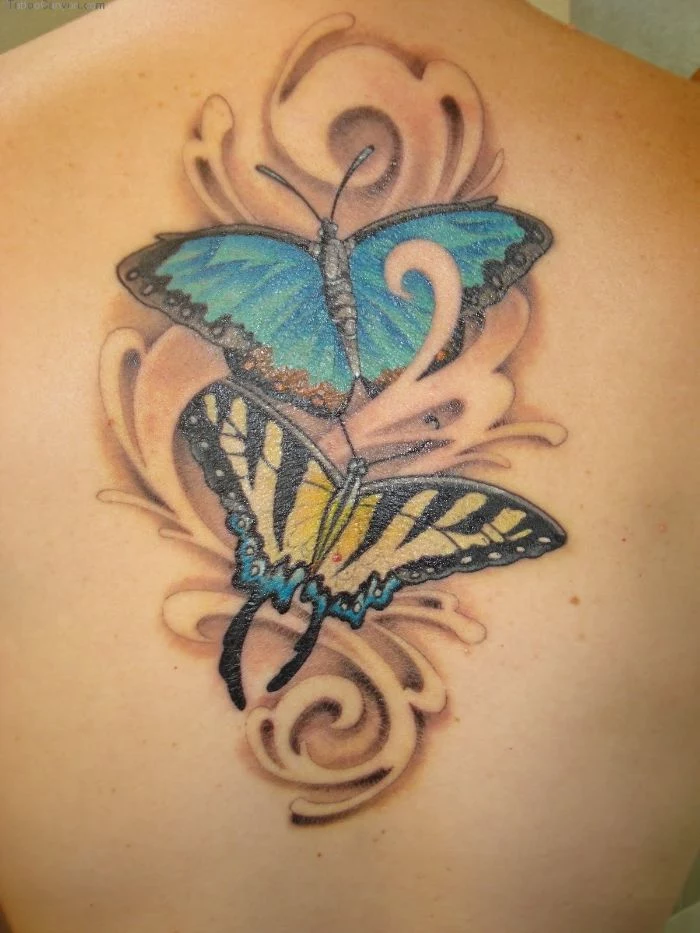 butterfly and flower tattoo two butterflies one in blue one in yellow back tattoo