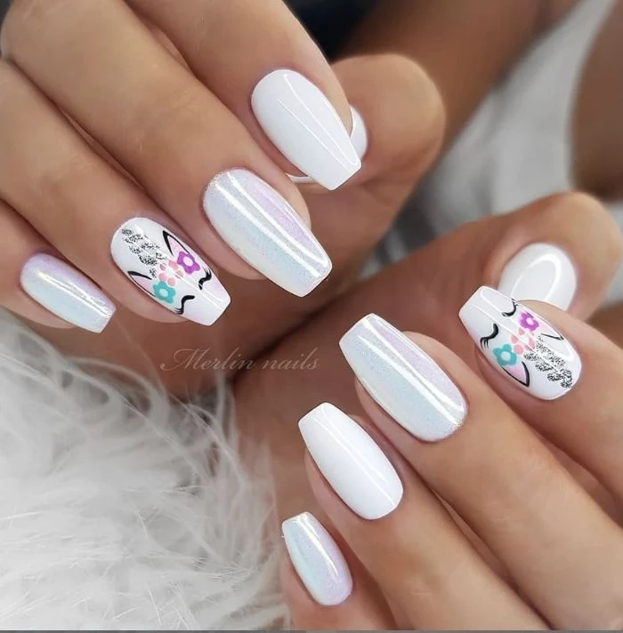 cute nail designs unicorn nails in white with unicorns drawn on ring and index fingers