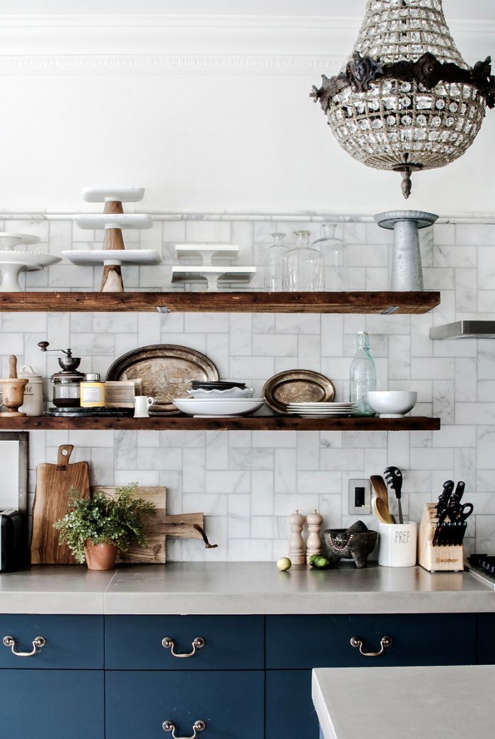 dark blue cabinets white countertop floating shelves kitchen ideas white tiled backdrop