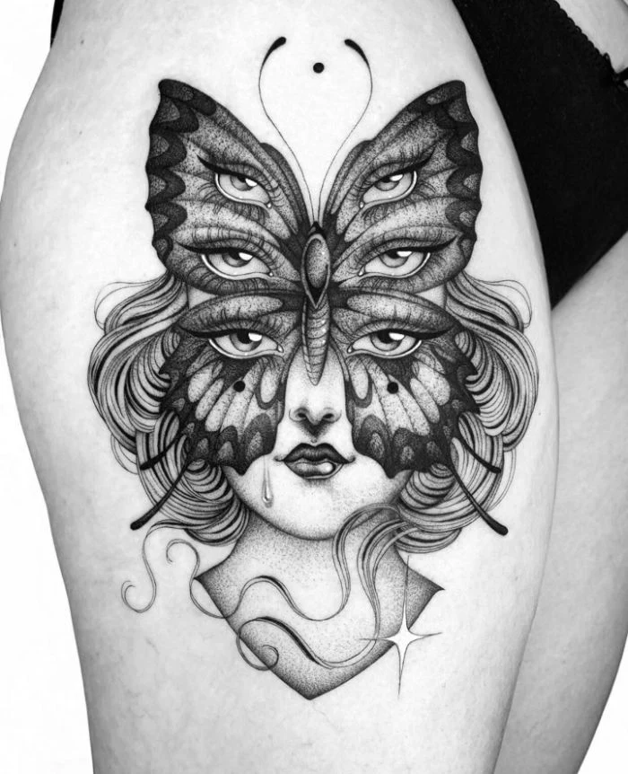 female face with large butterfly with three separate sets of eyes butterfly tattoo designs thigh tattoo