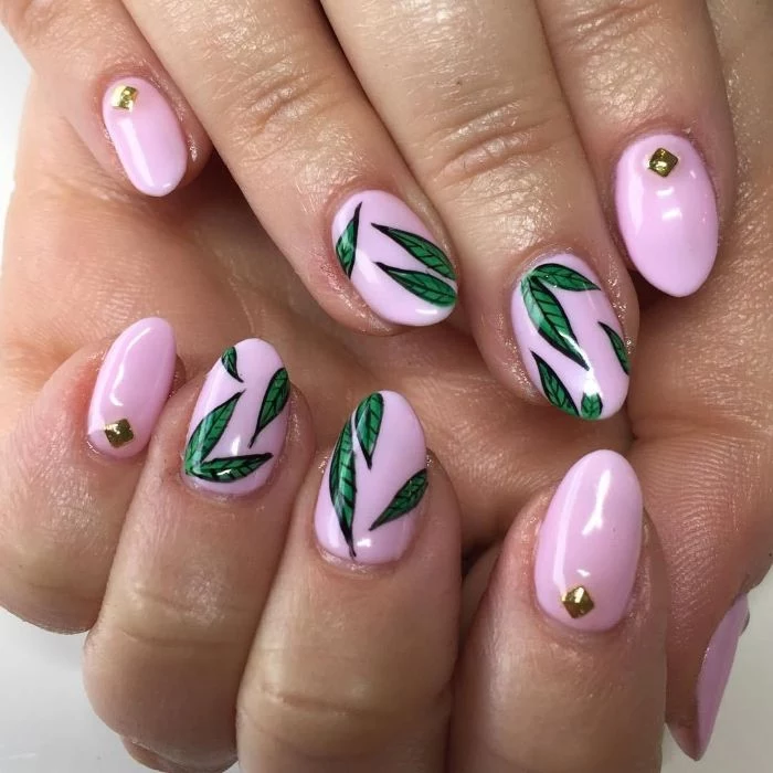 green leaves decorations on medium length almond nails flower nail designs pink nail polish with rhinestones