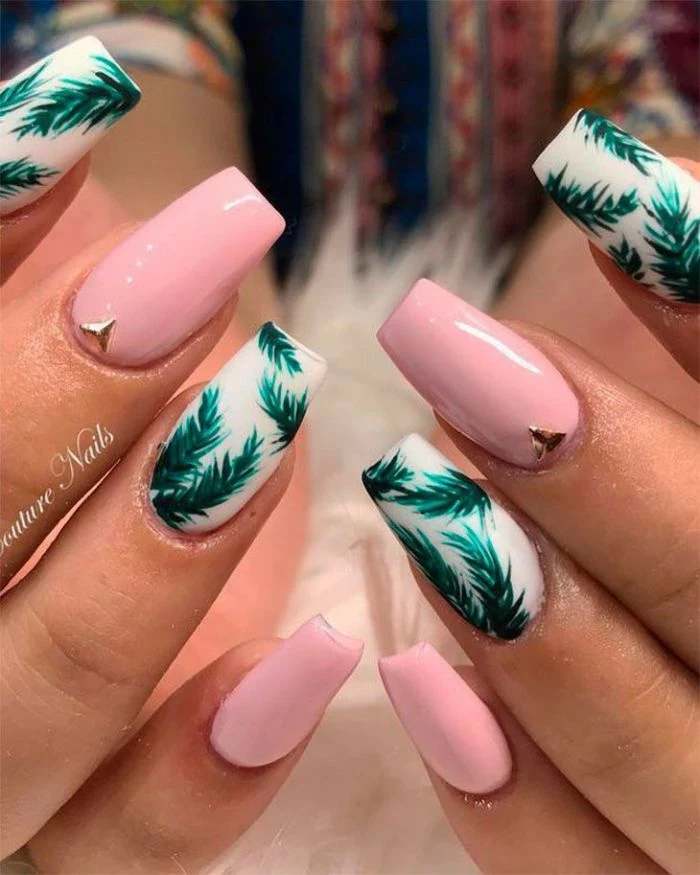 green palm leaves decorations on white nail polish base simple nail ideas pink nail polish with rhinestones