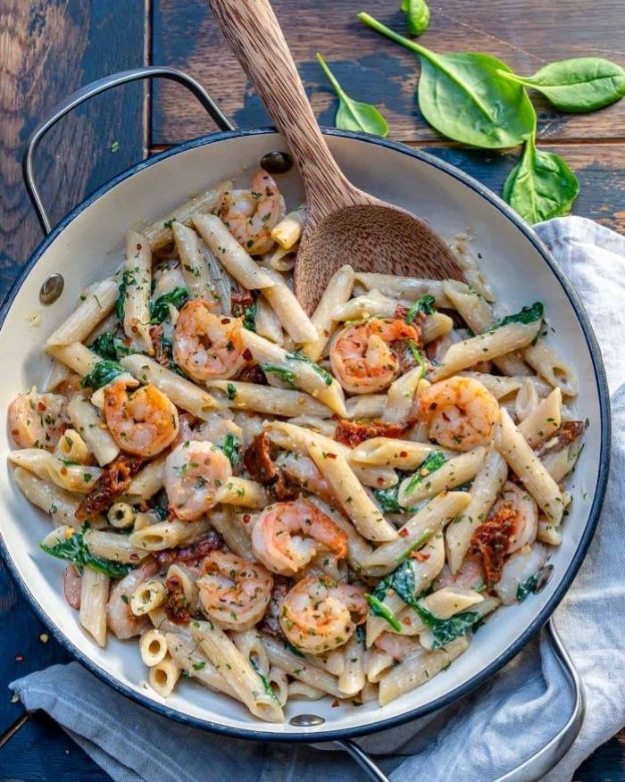 how to make pasta from scratch pasta with creamy sauce and shrimp garnished with parsley