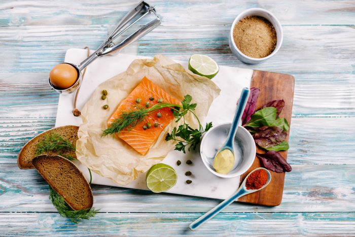 ingredients for salmon meatballs birthday party food ideas spread out on marble cutting board