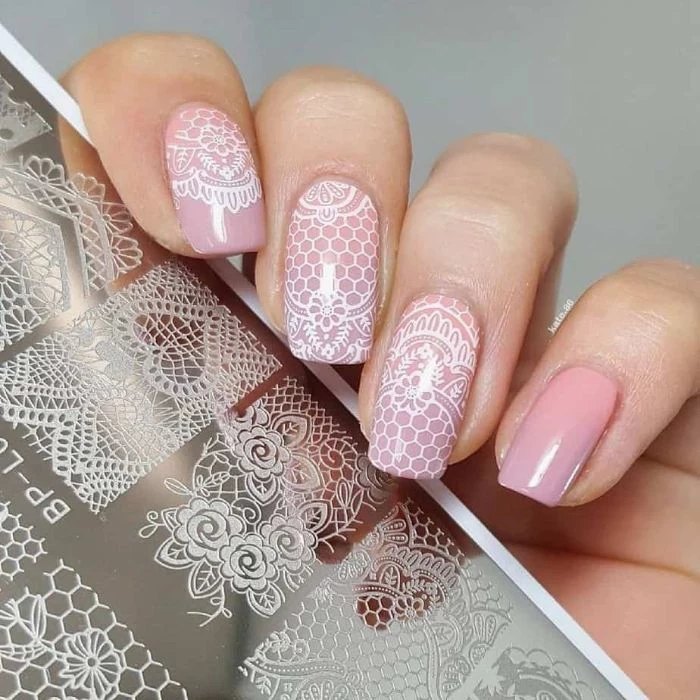 lace like white decorations on light pink nail polish spring nail colors 2021 medium length square nails