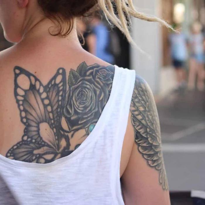 large back tattoo of butterfly with roses traditional butterfly tattoo angel wings on the arm