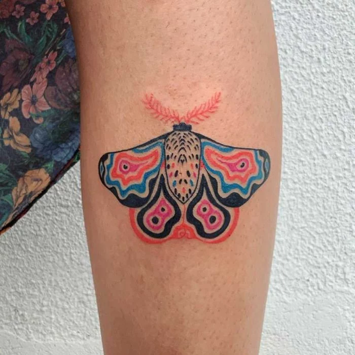 leg tattoo of colored abstract butterfly butterfly tattoo on arm white background